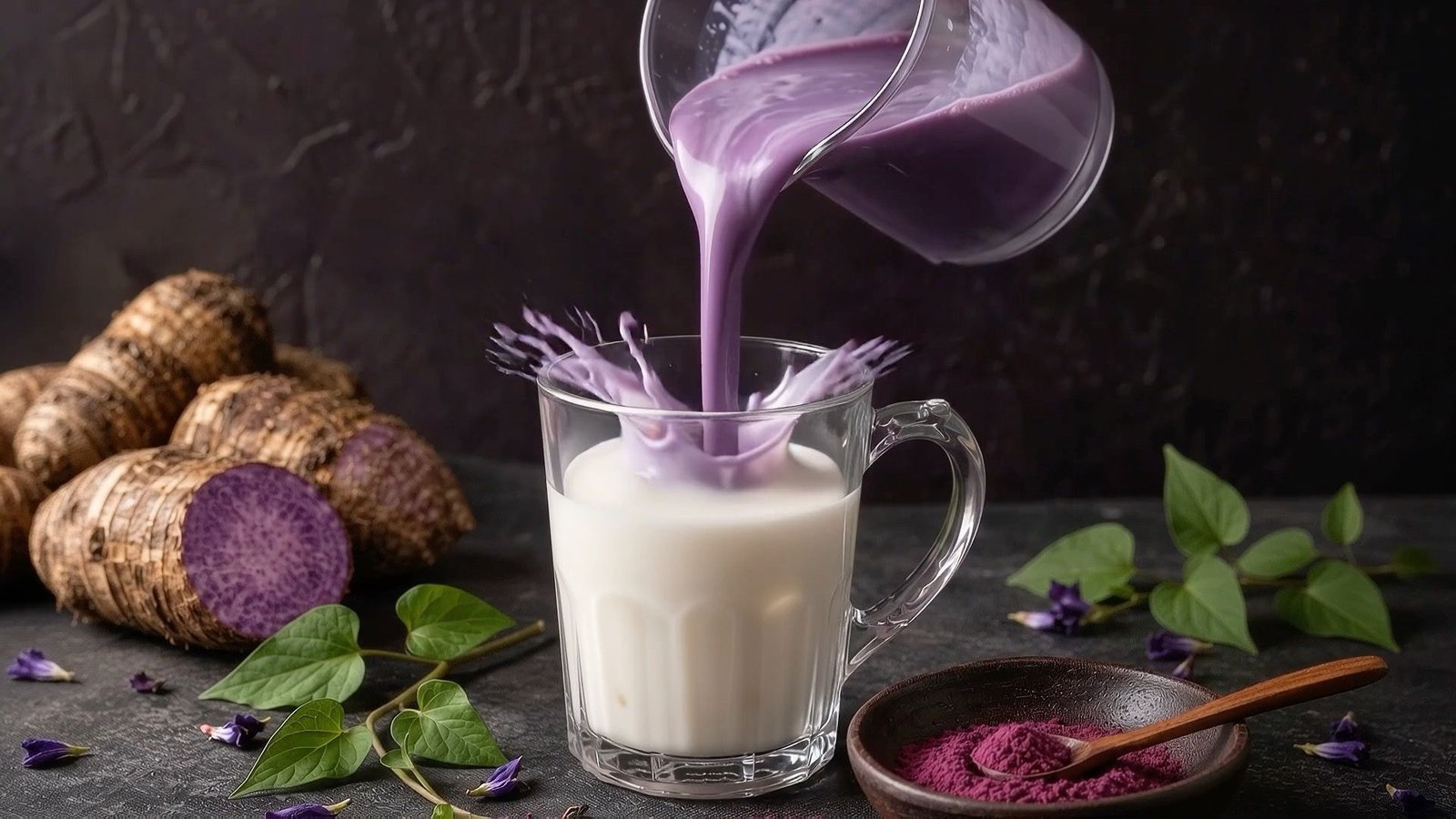 Violet liquid being poured into a glass of milk, with purple roots and a bowl of powder on a dark stone surface.